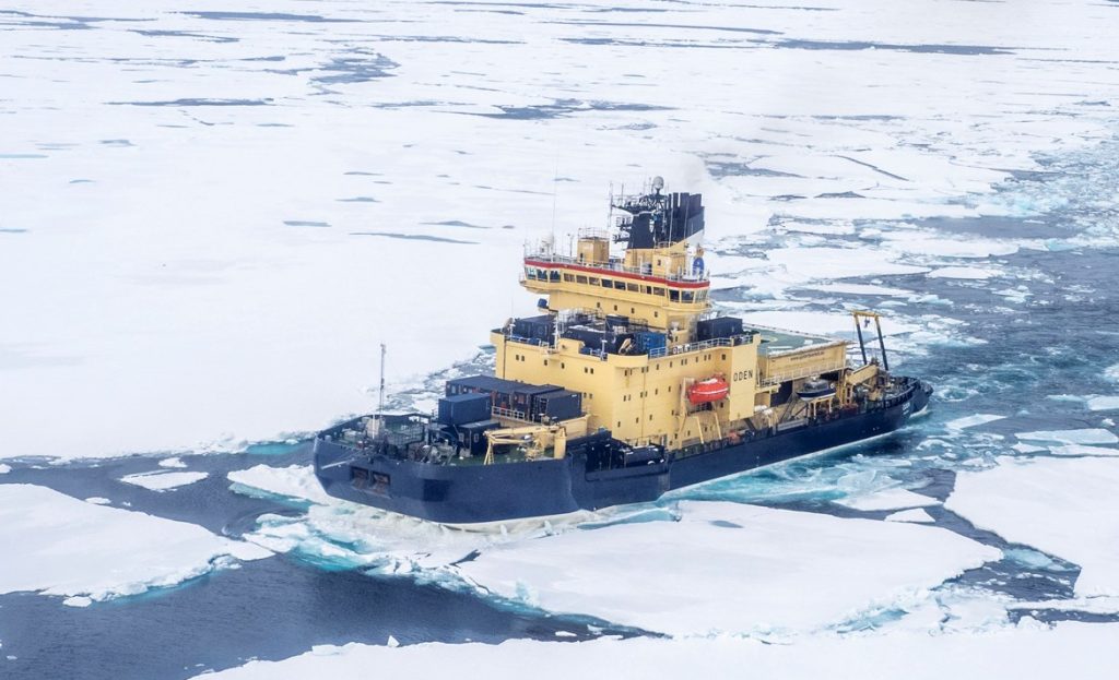 Bird view of the icebreaker Oden in an open lead in the sea ice.